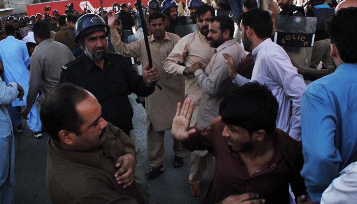 Policemen seen stopping activists of Awami Muslim League from reaching Committee Chowk during public gathering of the party.