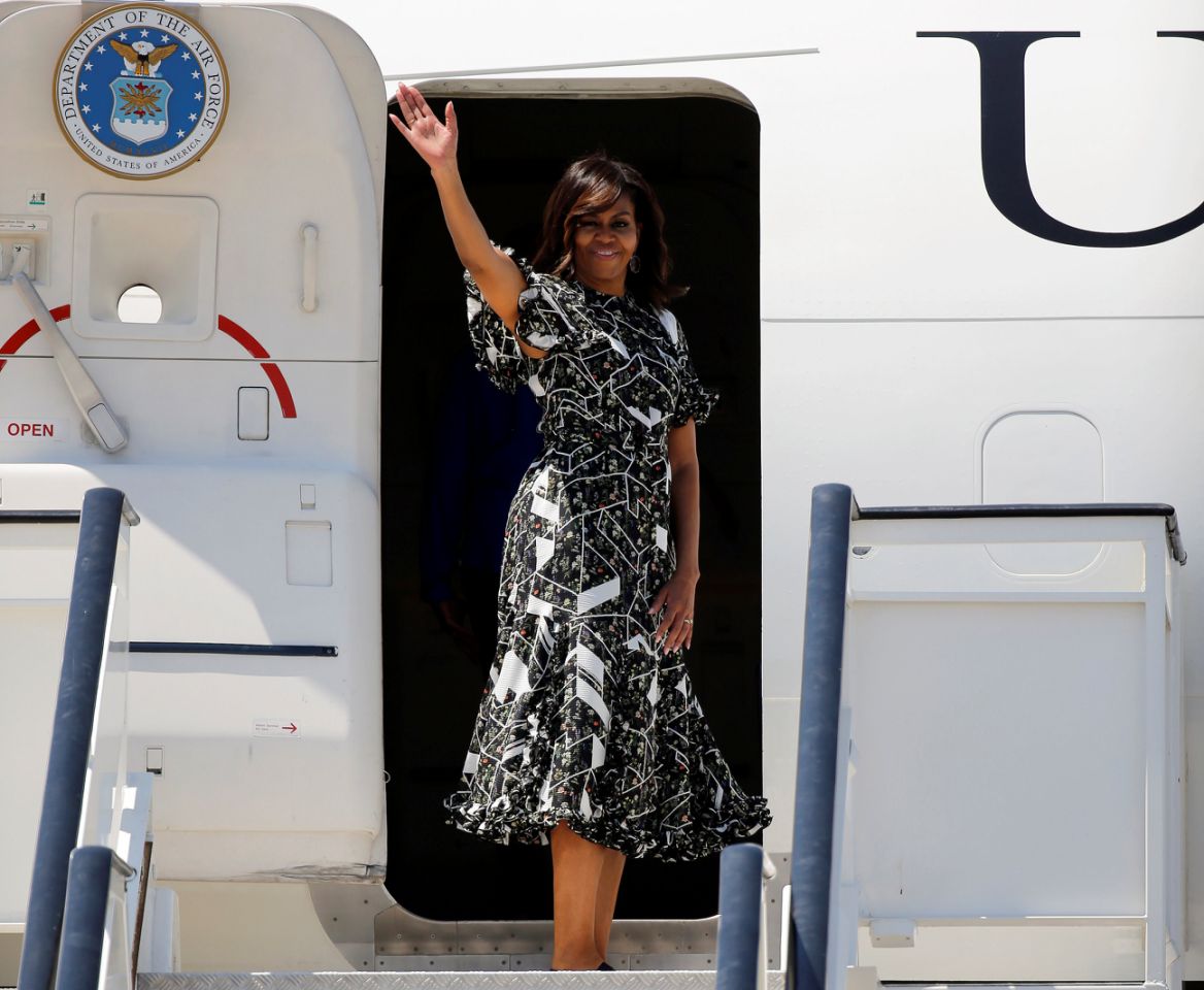 Michelle Obama waves before boarding her plane at the Torrejon airbase near Madrid, Spain July 1, 2016/REUTERS