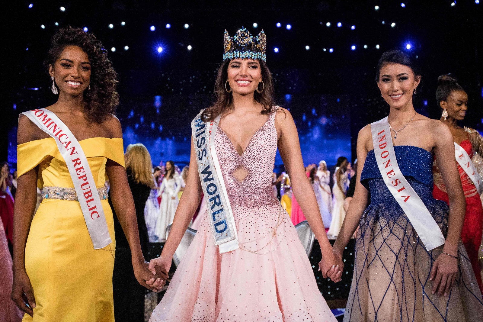 First runner up Miss Dominican Republic Yaritza Miguelina Reyes Ramirez (L); Miss World 2016 Stephanie Del Valle of Puerto Rico (C); and second runner up Miss Indonesia Natasha Mannuela (R)/AFP