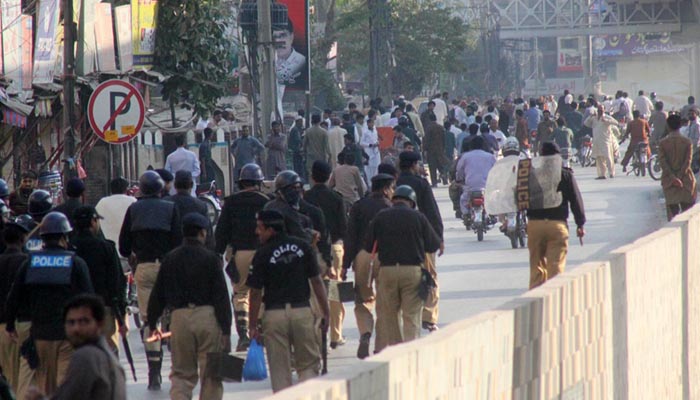 Riot policemen seen moving towards Committee Chowk during a public gathering of Awami Muslim League.