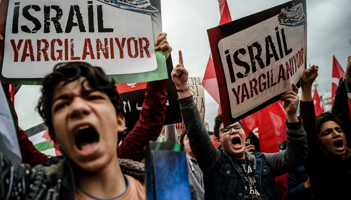 Turkish demonstrators protest an Israeli deal with Turkey after years of acrimony over a deadly 2010 raid on a Gaza-bound aid flotilla