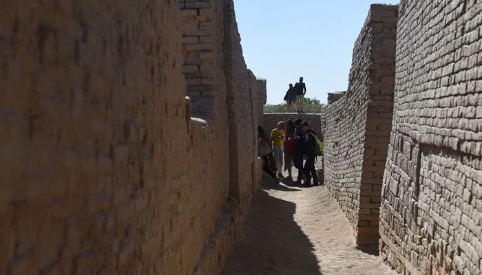 Visitors walk through the site. PHOTO: AFP
