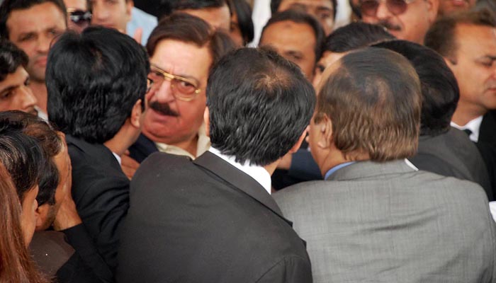 null Khurram Nawaz Gandapur of Pakistan Awami Tehreek seen arguing with leader of Pakistan Tehreek-e-Insaf Naeemul Haq at Supreme Court of Pakistan after hearing of Panama Papers leak case on Thursday-Photo ONLINE