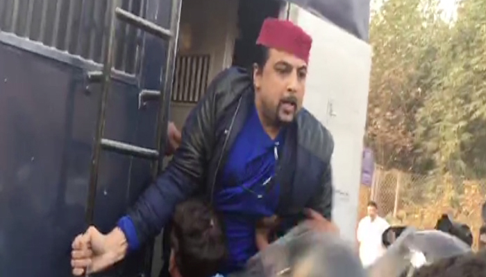 Salman Ahmad being detained by police in Bani Gala 