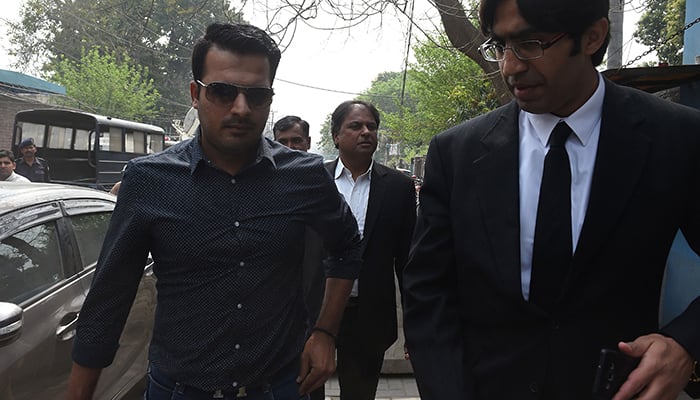 Sharjeel Khan (L) arrives with his lawyer at FIA  to record his statement in Lahore on March 21, 2017 – AFP 