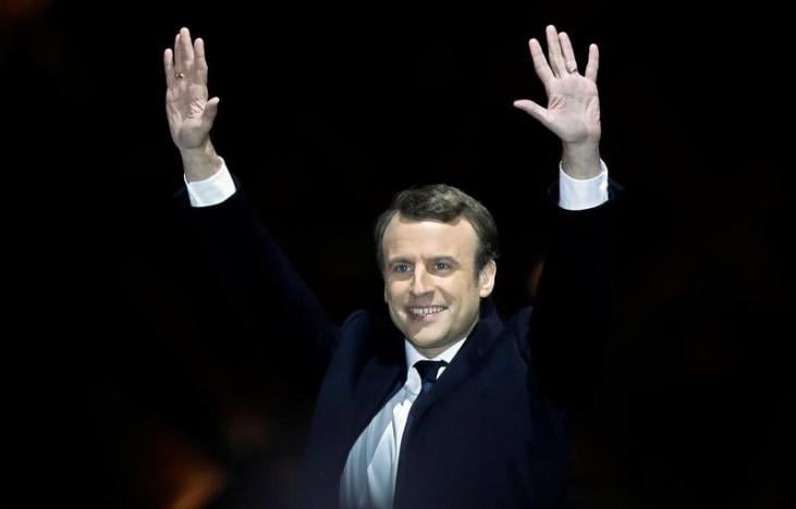 French President-elect Emmanuel Macron celebrates on the stage at his victory rally near the Louvre in Paris - Reuters