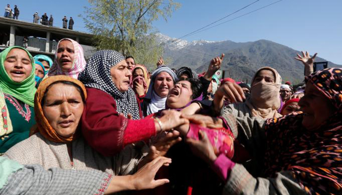Women wail during the funeral of Umar Farooq, a civilian who was killed on Sunday during a protest against by-polls - Reuters
