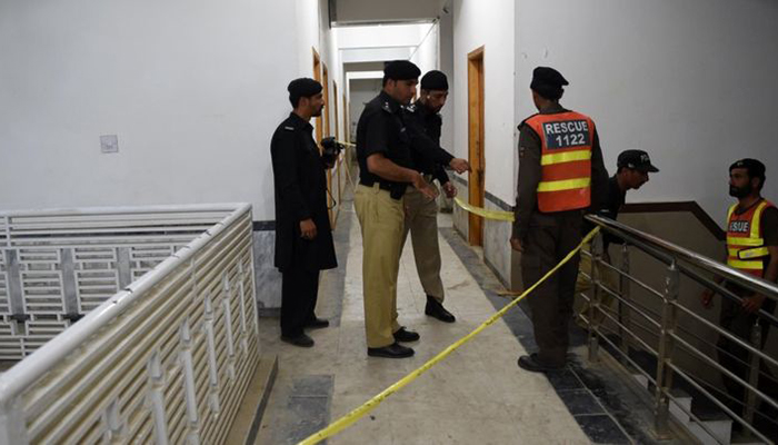Police inspect the hostel where Mashal Khan was killed by an angry mob on April 13 – AFP