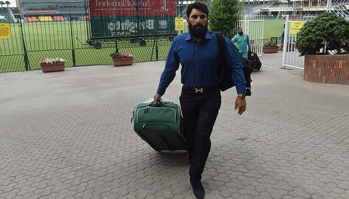 Pakistani Test cricket captain Misbah-ul-Haq leaves after speaking to media at the Gaddafi Cricket Stadium in Lahore - AFP