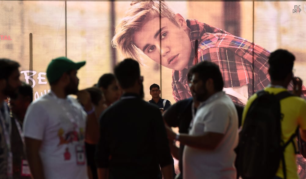 Indian fans gather at The D.Y Patil stadium ahead   of a concert by Canadian pop star Justin Bieber   in Navi Mumbai on May 10, 2017. Bieber mania   swept Mumbai on May 10 as the Canadian pop star   hit town to give his first concert in India in   front of 45,000 fans. - / AFP / PUNIT PARANJPE