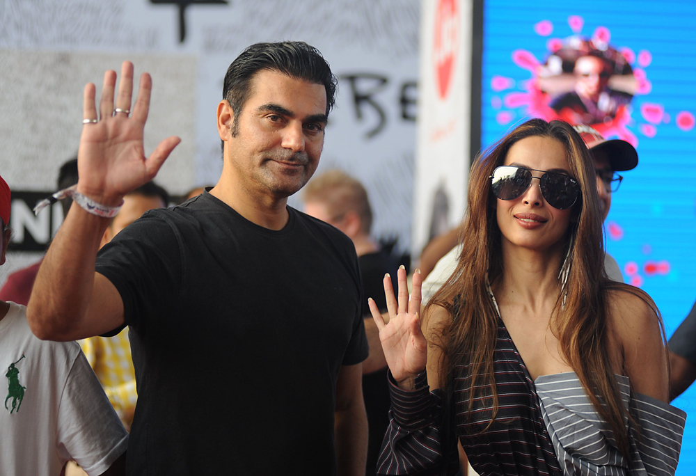 Indian Bollywood actor Arbaaz Khan (L) and   actress Malaika Arora Khan arrive to attend a   concert performance by Canada´s Justin Bieber at   The D.Y. Patil Stadium in Navi Mumbai on May 10,   2017. / AFP / Sujit JAISWAL