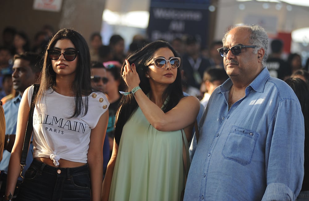 Indian Bollywood actress Sridevi (C) poses with   her daughter (L) and husband Boney Kapoor (R) as   they arrive to attend a concert performance by   Canada´s Justin Bieber at The D.Y. Patil Stadium   in Navi Mumbai on May 10, 2017. / AFP / Sujit   JAISWAL 