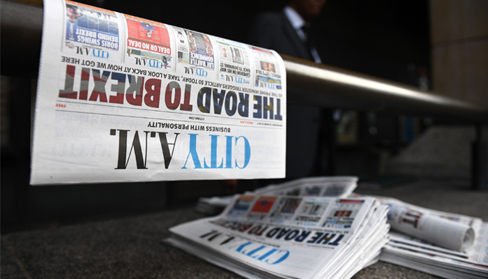 null Free newspapers are left outside Westminster station in central London on March 29, 2017. British Prime Minister Theresa May will formally launch Brexit today after signing the letter to begin the country´s departure from the European Union. / AFP / Justin TALLIS