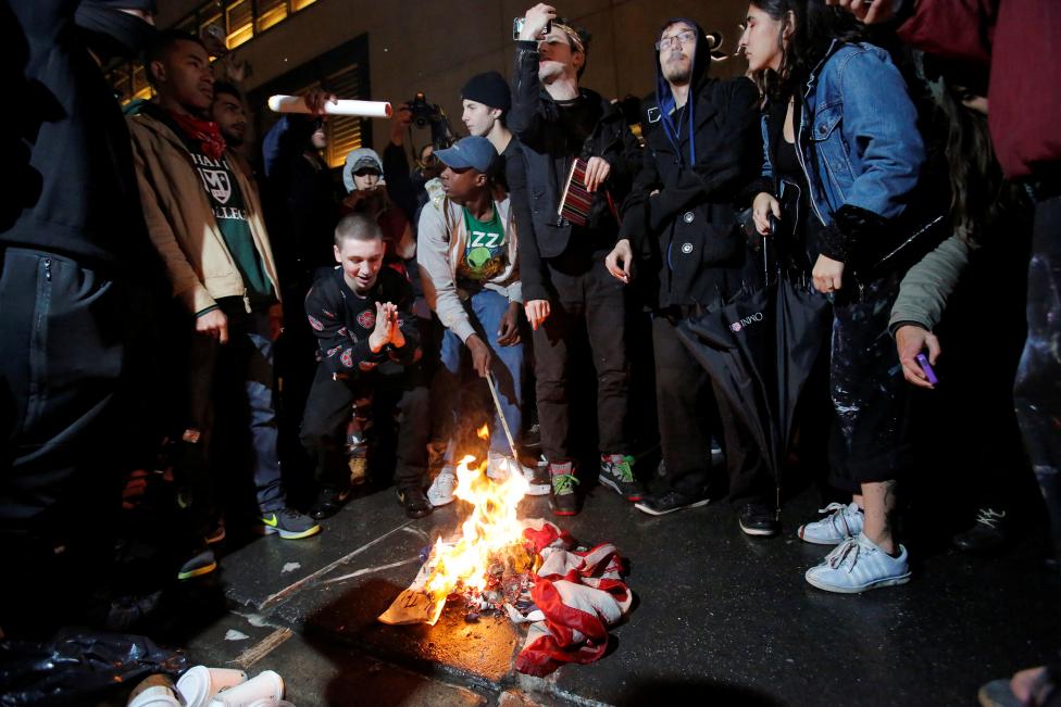 Protesters burn a U.S. flag outside Trump Tower in Manhattan.