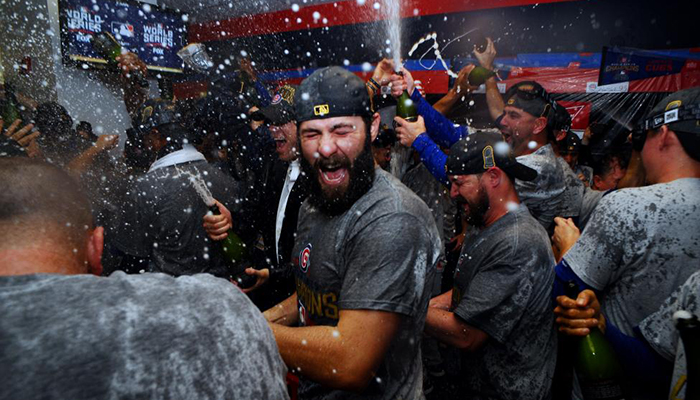 Chicago Cubs starting pitcher Jake Arrieta celebrates in the clubhouse.