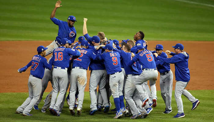 Chicago Cubs players celebrate after defeating the Cleveland Indians.