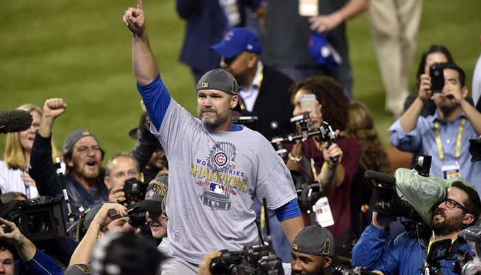 Chicago Cubs catcher David Ross is carried off the field after defeating the Cleveland Indians.