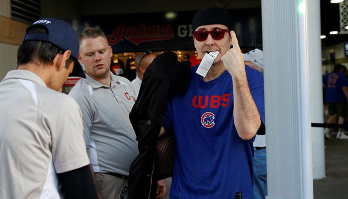 Actor John Cusack, a fan of the Chicago Cubs, enters Progressive Field before Game 7