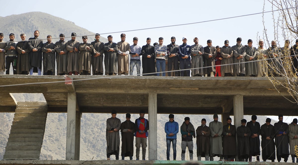 Kashmiri villagers offer prayers during the funeral of Umer Farooq, a civilian killed by Indian forces in Indian Occupied Kashmir, on April 10, 2017.—AP Photo