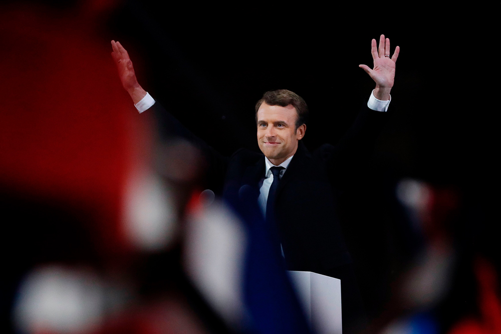 French president-elect Emmanuel Macron waves to   the crowd as he delivers a speech at the Pyramid   at the Louvre Museum in Paris on May 7, 2017,   after the second round of the French presidential   election. AFP / Patrick KOVARIK