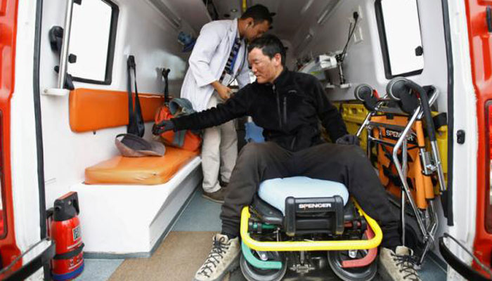 Chinese climber Liu Lei, who says he successfully climbed Mount Everest, gets a checkup inside an ambulance after returning from Mount Everest summit in Kathmandu, Nepal - Reuters