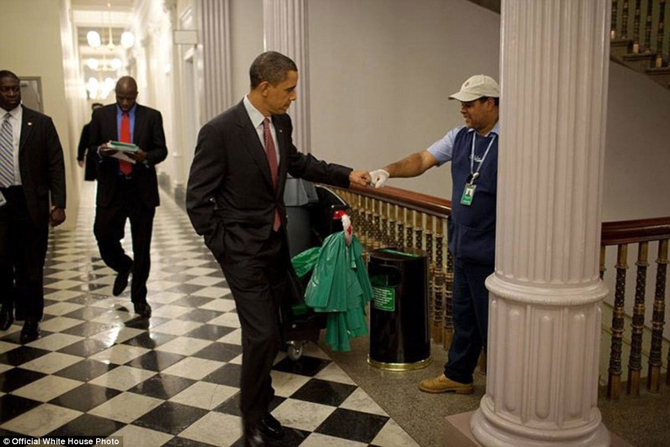 December 3, 2009. Obama fist-bumps custodian Lawrence Lipscomb in the Eisenhower Executive Office Building following the opening session of the White House Forum on Jobs and Economic Growth 