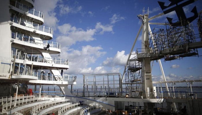 Shipbuilders work on the Harmony of the Seas class ship at the STX Les Chantiers de l
