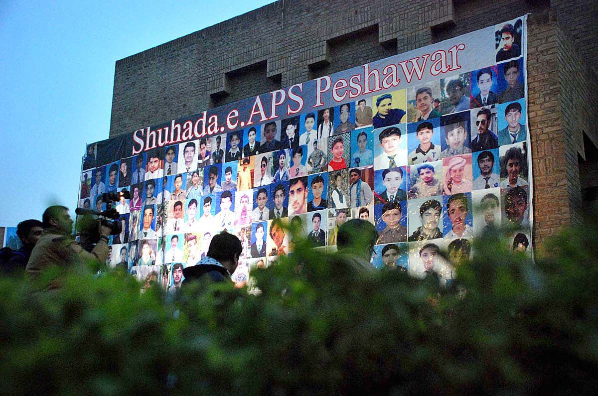 Relatives of APS victims hold candlelight vigil at Yadgar-e-Shuhda to pay tribute to martyrs of APS terrorist attack/APP