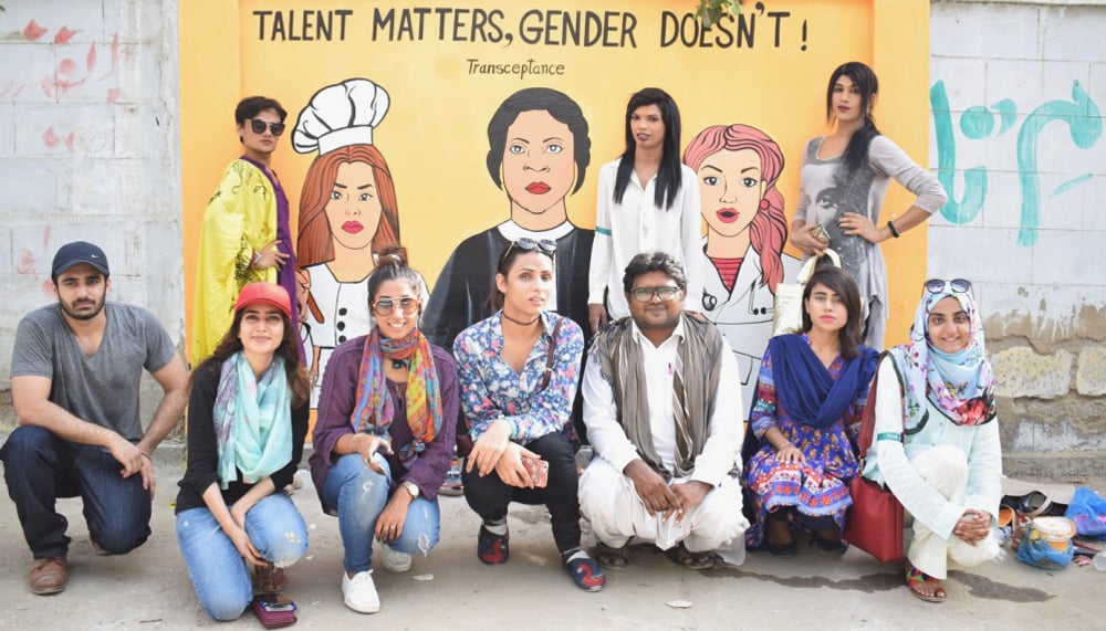 Students and volunteers pose against the mural, while Mohni, Soniya, and Shilpa pose with their respective painted images, Karachi, Pakistan, May 16, 2017