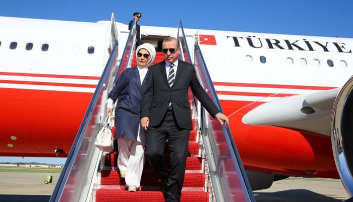Turkish President Tayyip Erdogan, accompanied by his wife Emine Erdogan, disembarks from a plane upon his arrival in Washington, US, May 15, 2017. Kayhan Ozer/Presidential Palace/Handout via REUTERS