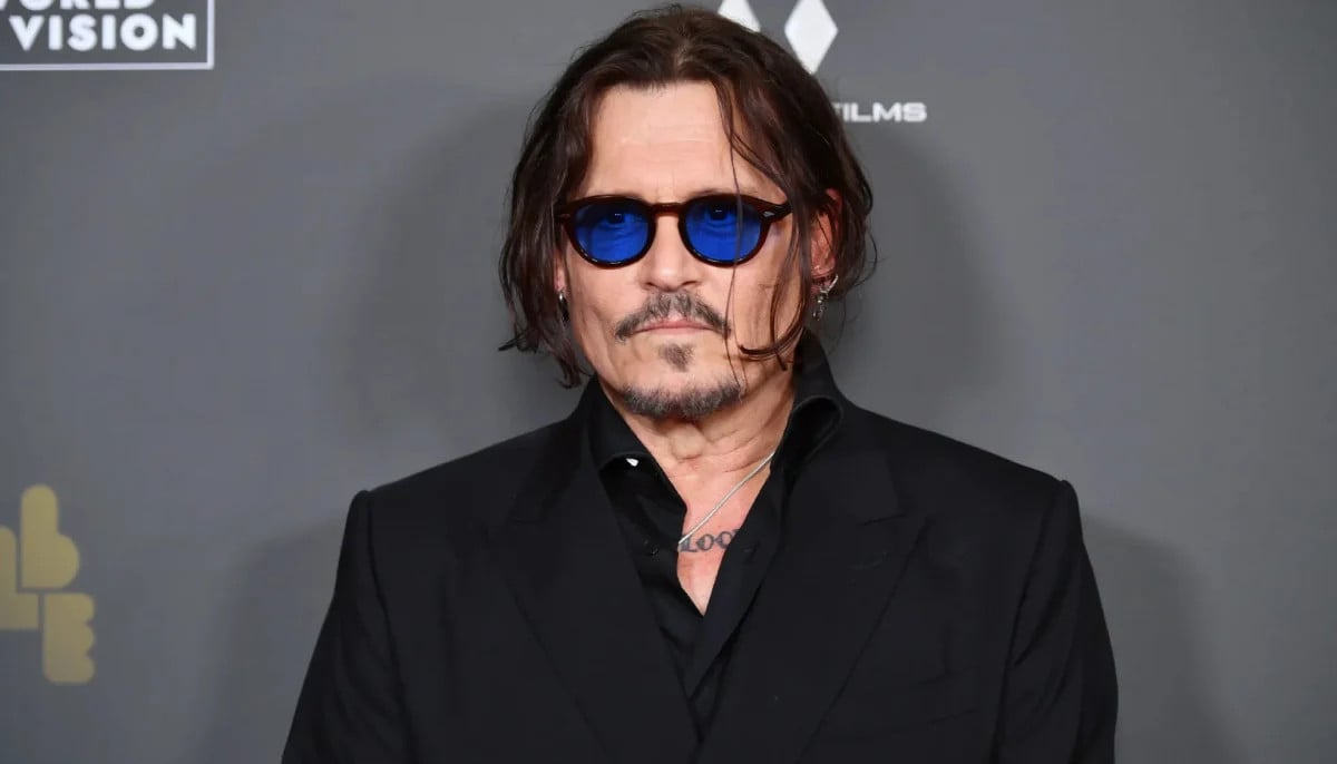 Johnny Depp promotes new brand at L.A. red carpet