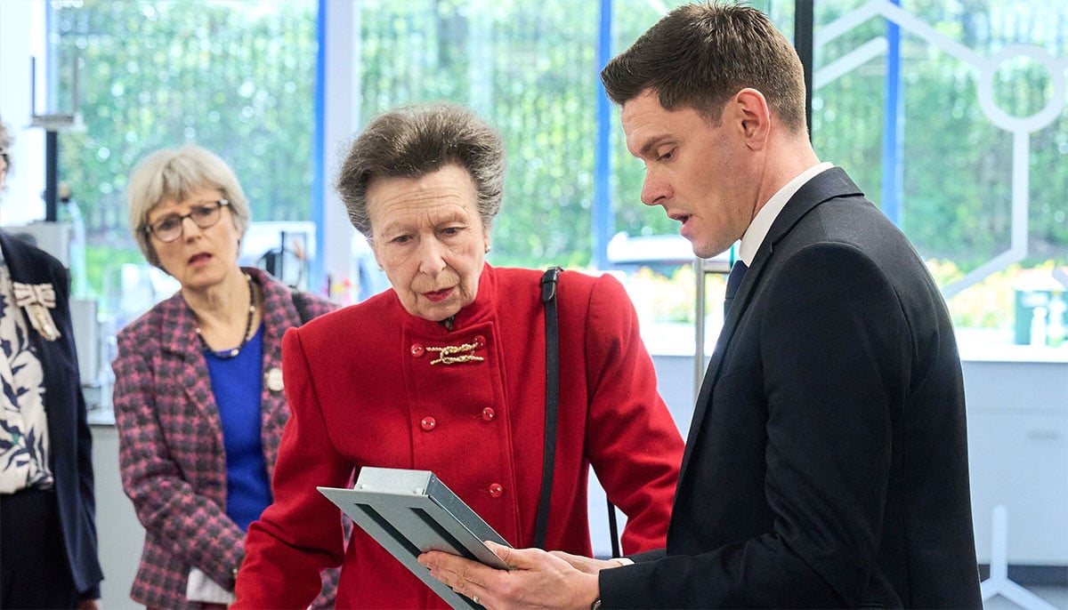 Princess Anne brings the heat while touring fire protection labs in bold red 