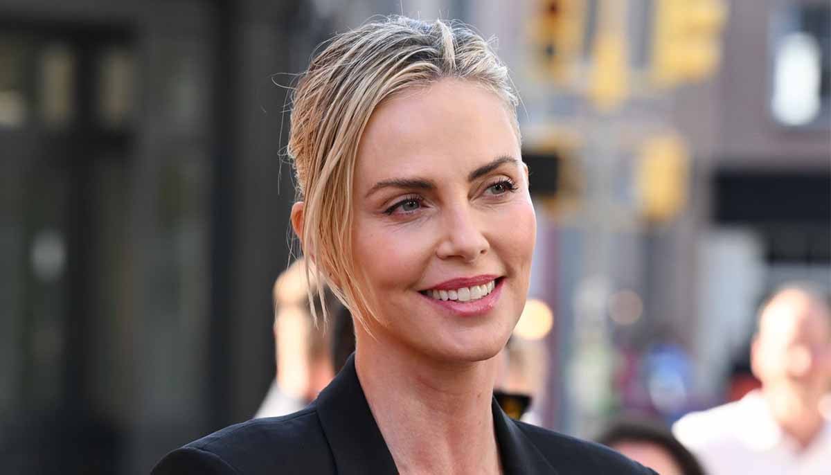Charlize Theron climbs Times Square billboard to launch Netflix ‘Apex'