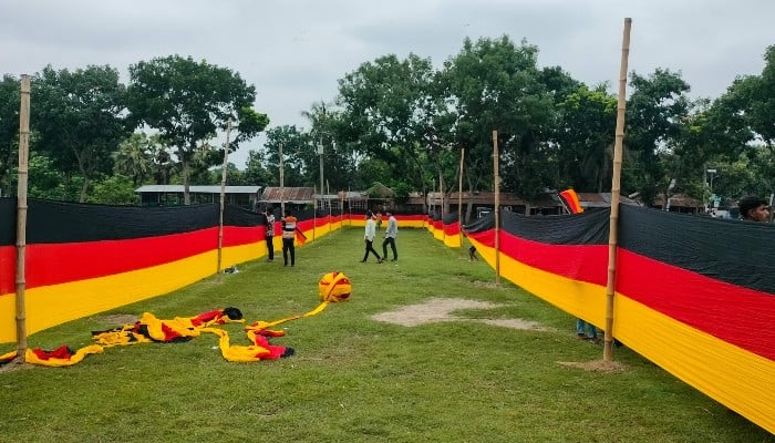 Bangladesh farmer unfurls vast Germany banner to show World Cup support