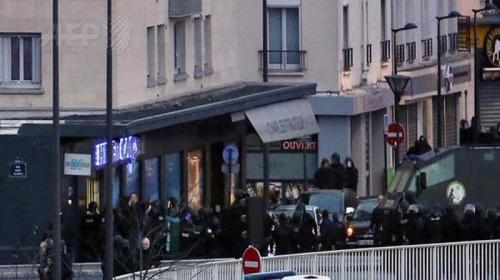 Charlie Hebdo suspects killed as twin sieges rock France