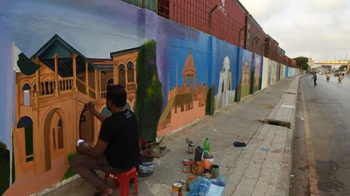 Karachi artists reclaim city walls from hate graffiti