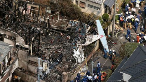 Light plane crashes into Tokyo residential area, sets houses ablaze