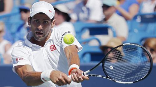 Djokovic routs Wawrinka to book semi spot
