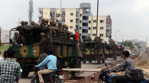 Troops patrol Modi’s home state after deadly riots