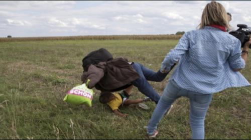 Outrage over Hungarian camerawoman who kicked fleeing migrants