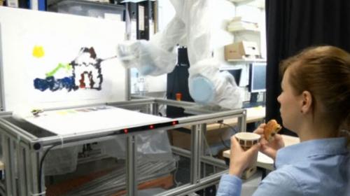 Scientist eats, drinks and paints simultaneously