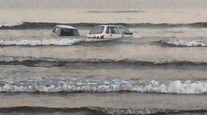 Cars spotted floating in the sea in Karachi