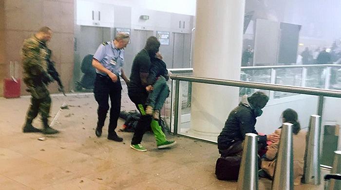 Blasts rock Brussels airport, metro; at least 37 killed