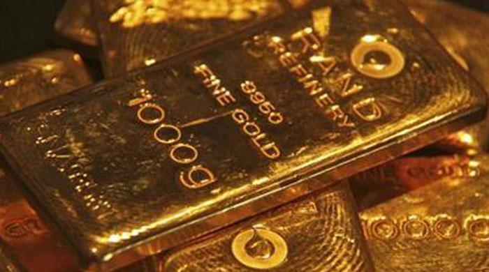 Gold jumps to 7-week high in international market on dollar slump