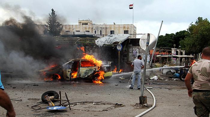 Blasts kill more than 120 in Syrian government-held cities