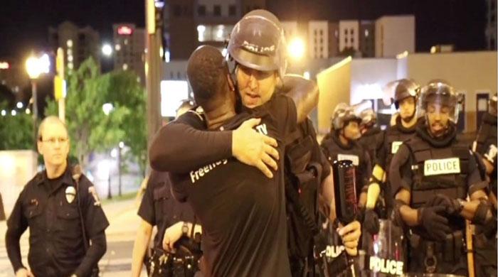Free hugs for cops amidst angry protests in Charlotte