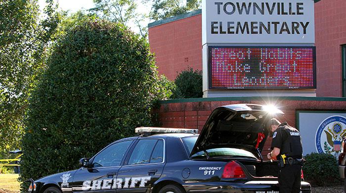 Three injured in US school shooting, suspect in custody: police