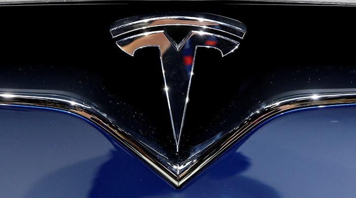 Tesla says self-driving hardware to be built into all its cars