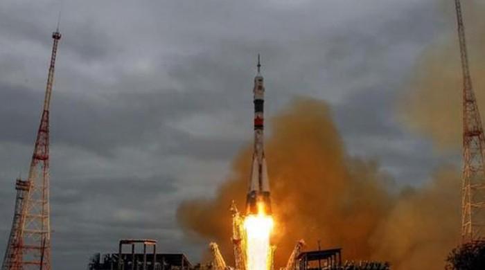 Spaceship carrying three-man crew docks with ISS, NASA TV reports