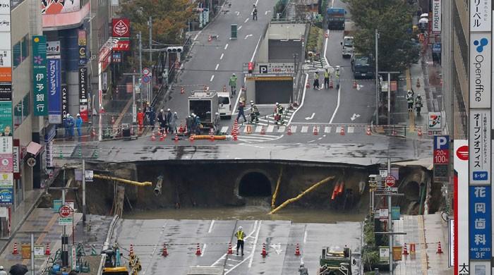 Giant sinkhole swallows street in Japan